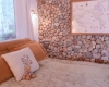 Casa Camilla Aspen Tropical Apartment bedroom stone wall