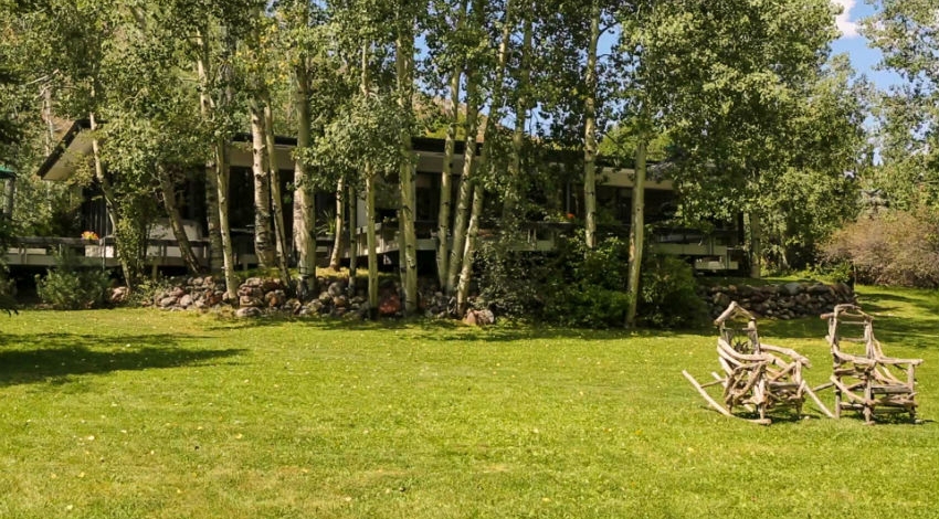 Casa Camilla Aspen Main House exterior lawn chairs